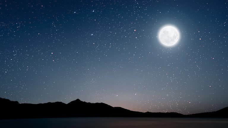 Serene night sky with soft moonlight over calm landscape